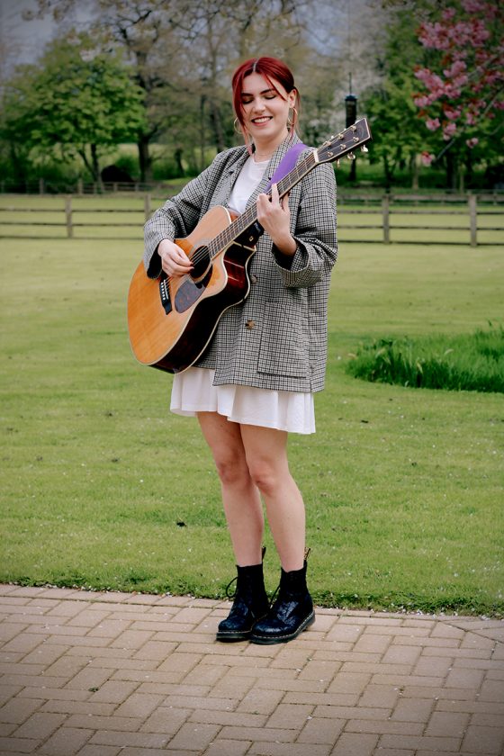 female singer guitarist